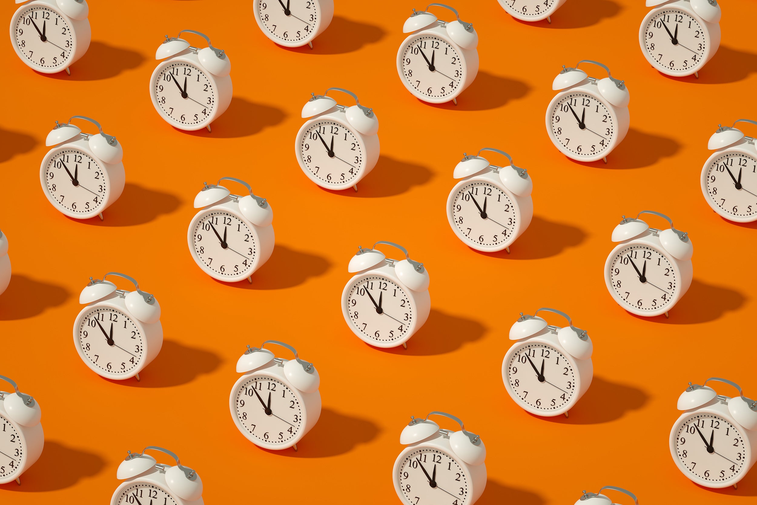 Photo illustration of alarm clocks.