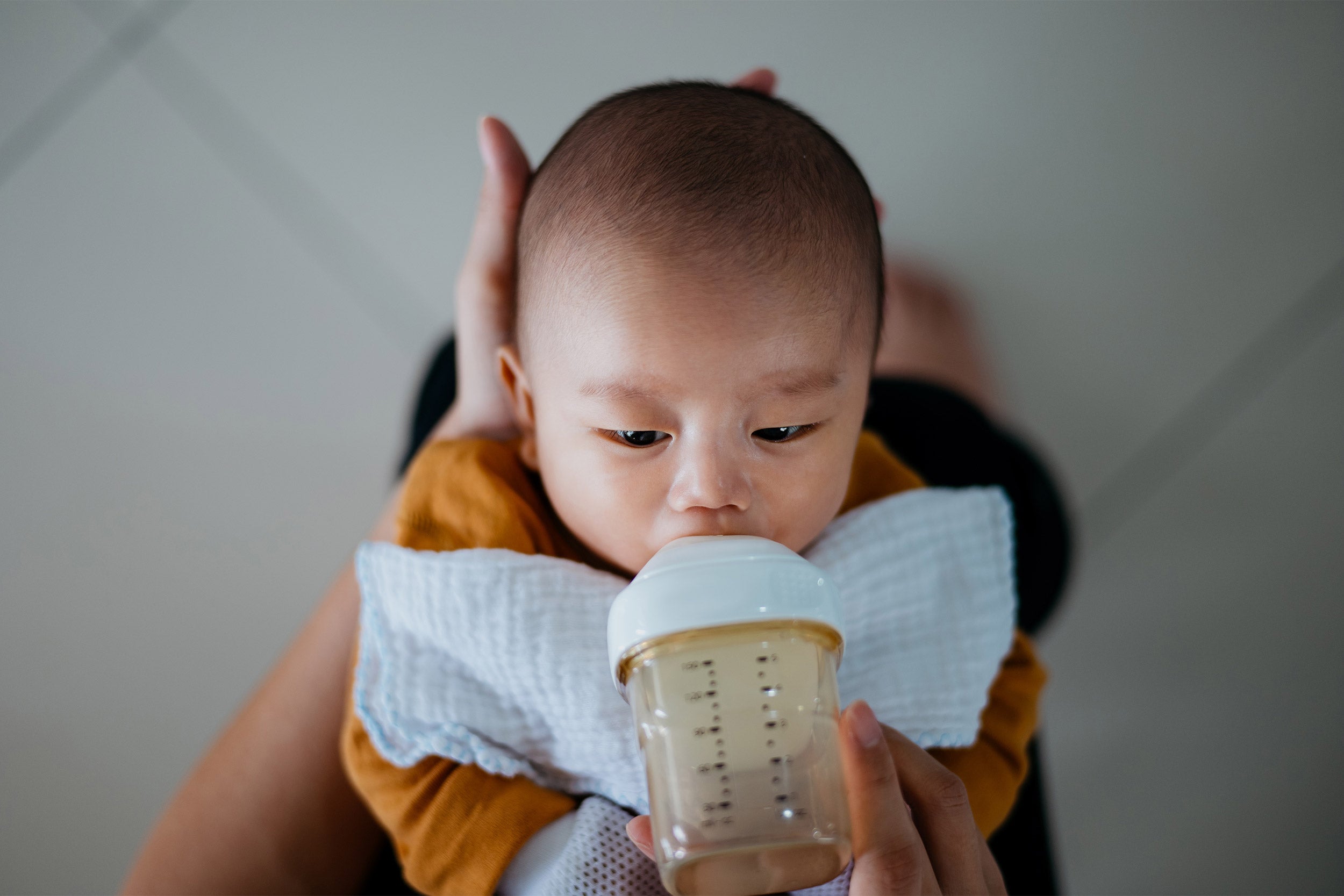 Mother feeding child.